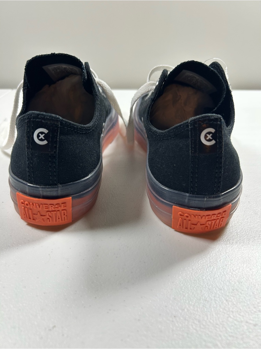 Converse women’s Black Canvas Low-Top Sneakers with Orange Heel